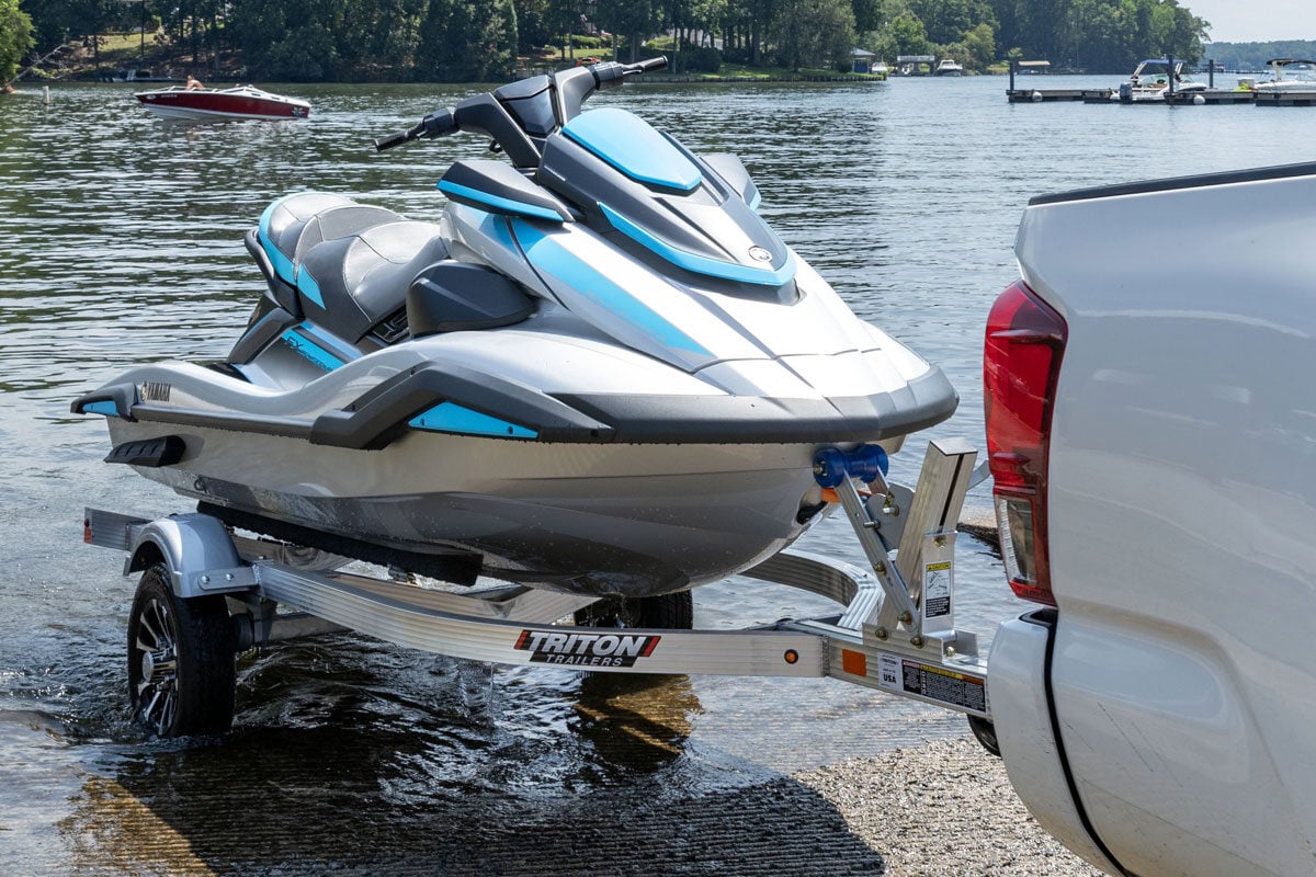 Triton LT Series Single Trailer With Watercraft Being Pulled Out Of Water