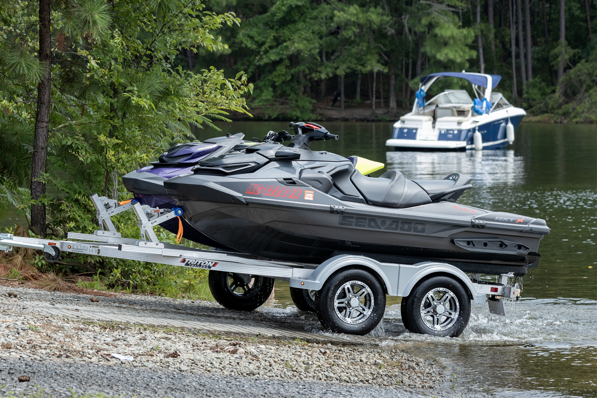 Two Place Elite Series Trailer With Watercraft In Front Of Lake